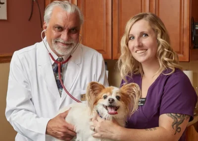 Pinecrest Animal Hospital team with dog